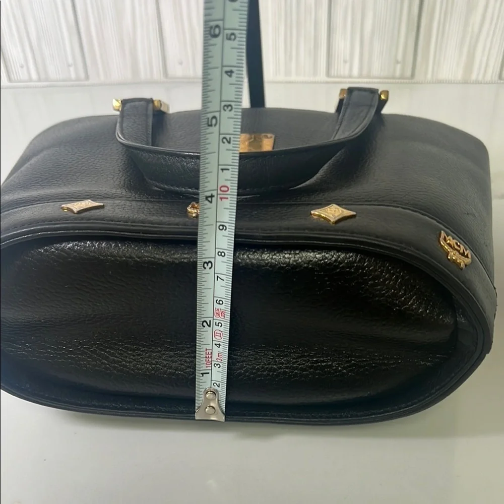 MCM Black Mini Tote with Gold Accents and Trapezoid Shape